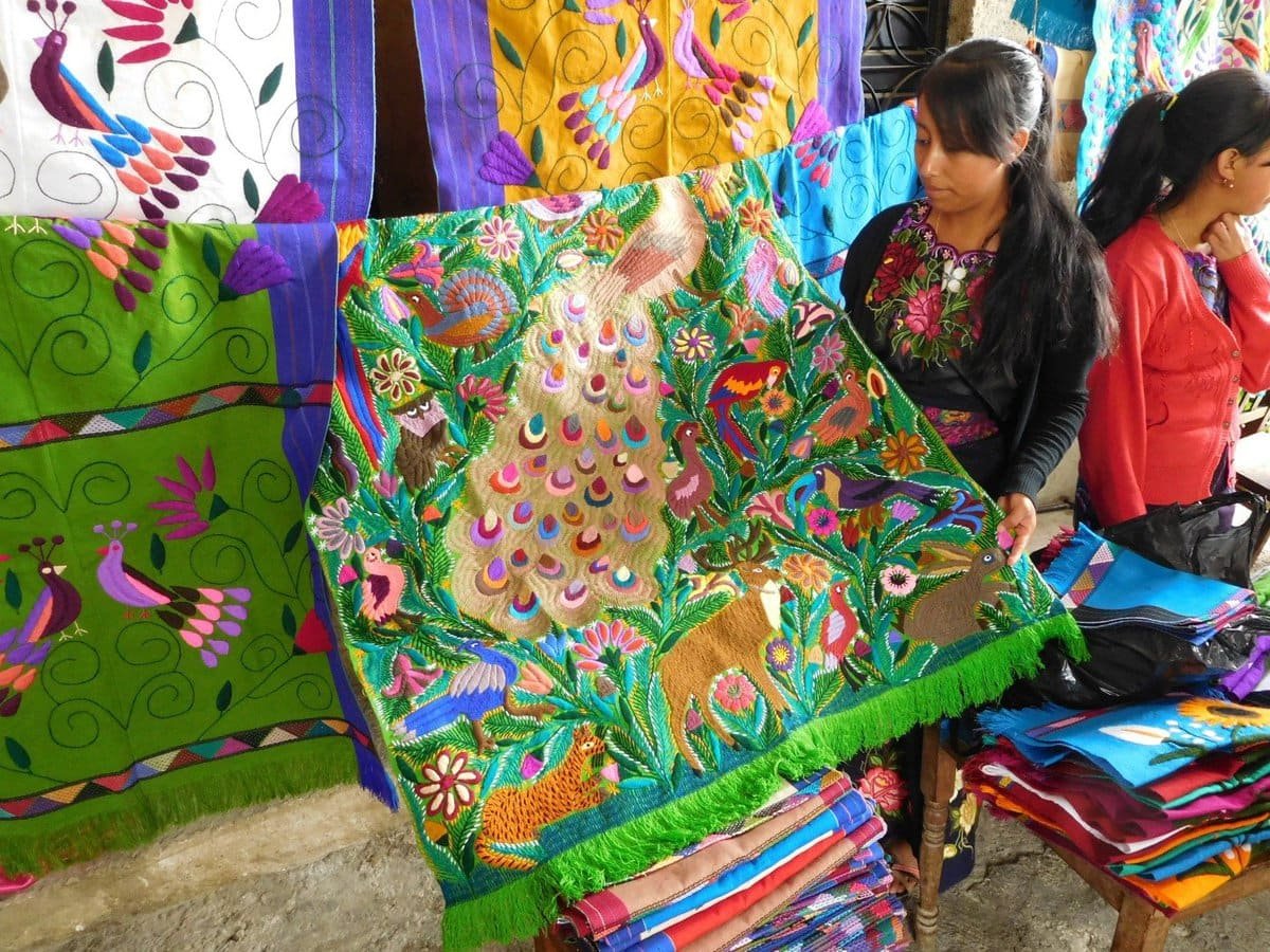 One of the daughters with hand embroidered fabric